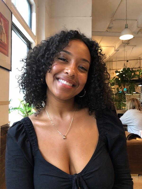 Natural dating profile portrait of a woman in a cafe